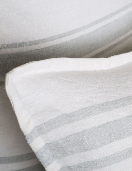 #color::white-and-ocean #size::euro #size::king #size::standard | Detailed shot of the Jackson Linen white and ocean striped Sham by Pom Pom at Home