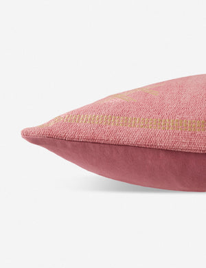 Side view of the Mirana pink throw pillow with an arabesque pattern and a woven cotton front