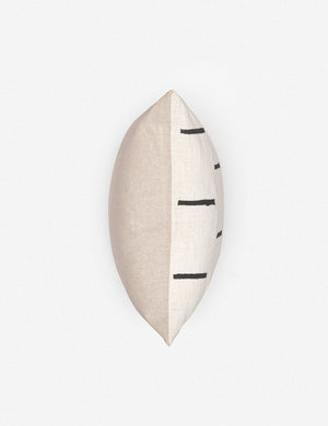 View of where the front and back connect on the Rainey mudcloth ivory and black pillow with a hidden zipper and gray linen back