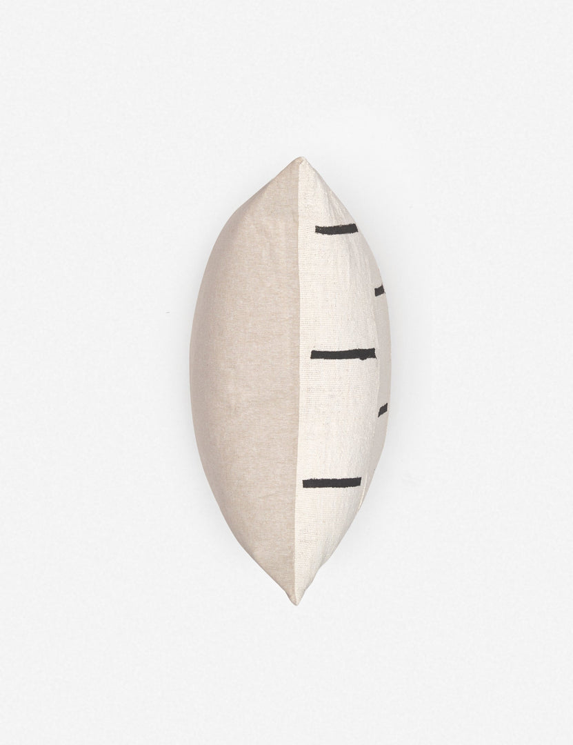 #color::ivory | View of where the front and back connect on the Rainey mudcloth ivory and black pillow with a hidden zipper and gray linen back