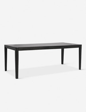 Angled view of the Reese black mango wood rectangular dining table.