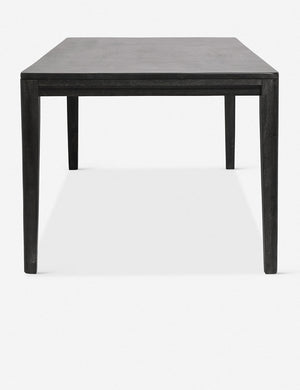Side view of the Reese black mango wood rectangular dining table.