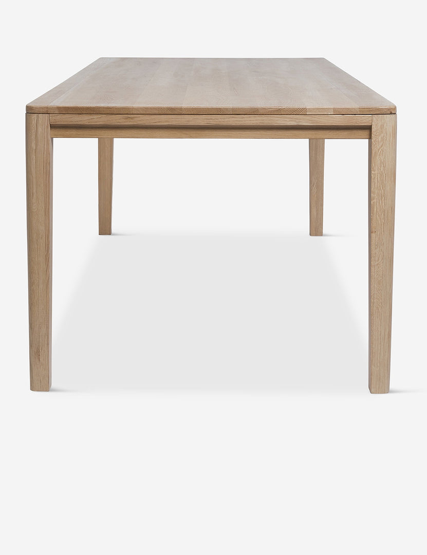 #color::oak #size::82-W | Side view of the Reese oak wood rectangular dining table.