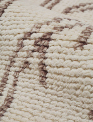 Detailed shot of the sheep wool material on the Rehya neutral geometric wool patterned rug