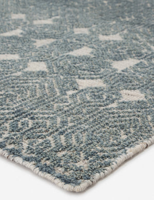 Close-up of the corner of the Carleigh hand-knotted blue-gray patterned Rug