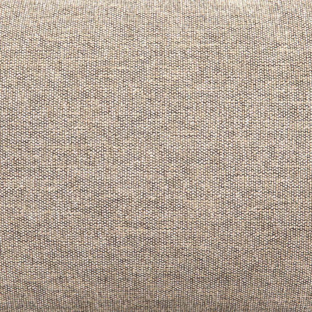 | Detailed view of the natural-linen fabric on the Rhea accent chair with natural-toned cushions and curved wicker back