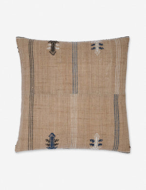 Rica taupe square throw pillow with blue, white, and black woven arrow-like designs