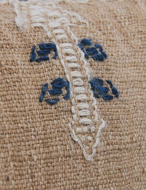 Close-up of the white and blue arrow-like design on the Rica throw pillow