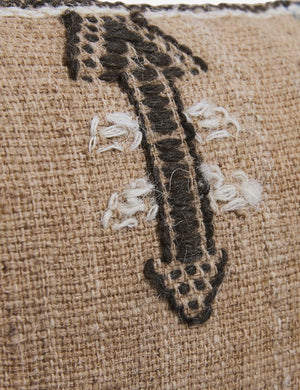 Close-up of the white and black arrow-like design on the Rica throw pillow