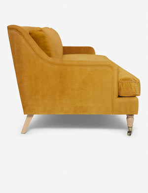 Side of the Rivington goldenrod velvet sofa