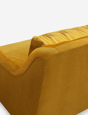 Back corner of the Rivington goldenrod velvet sofa