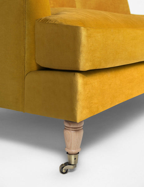 #size::72-W #size:84-W #color::goldenrod-velvet #size::96-W | Wheeled legs on the Rivington goldenrod velvet sofa