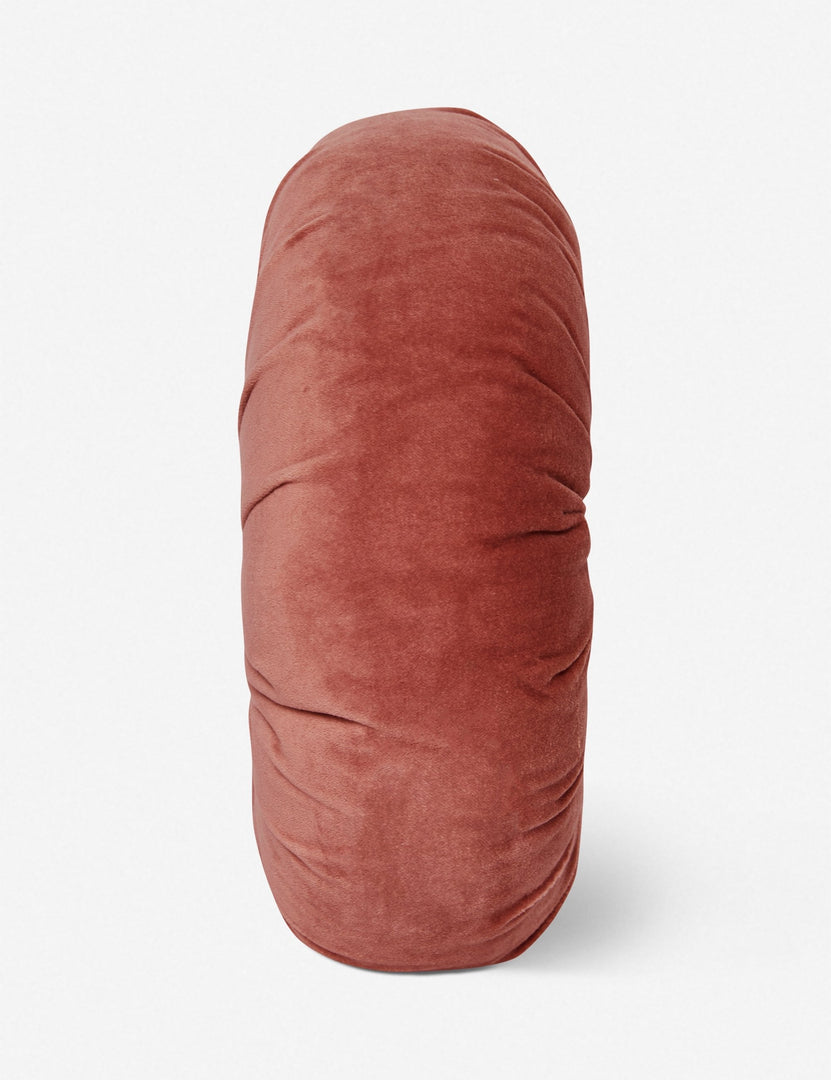 #color::coral | Side view of the Monroe coral pink velvet round pillow