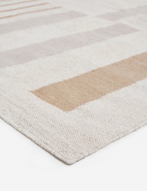 Close-up of the corner of the afi bauhaus-inspired neutral striped area rug