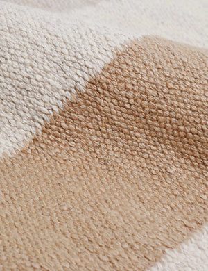 Detailed view of the viscose yarn fabric on the Safi bauhaus-inspired neutral striped area rug
