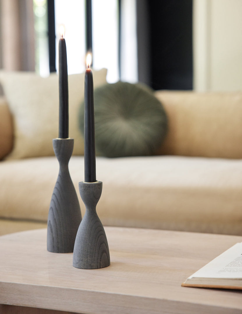 #size::small #color::grey #size::medium | The Pantry white wooden candlestick with smooth curves by farmhouse pottery in its small and medium size sit on a coffee table
