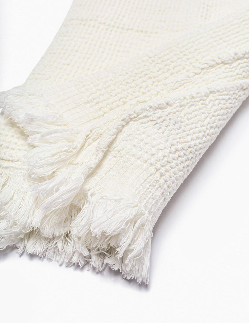 #color::white | Close up of the tasseled ends on the Sherra white Waffle Towel by House No. 23