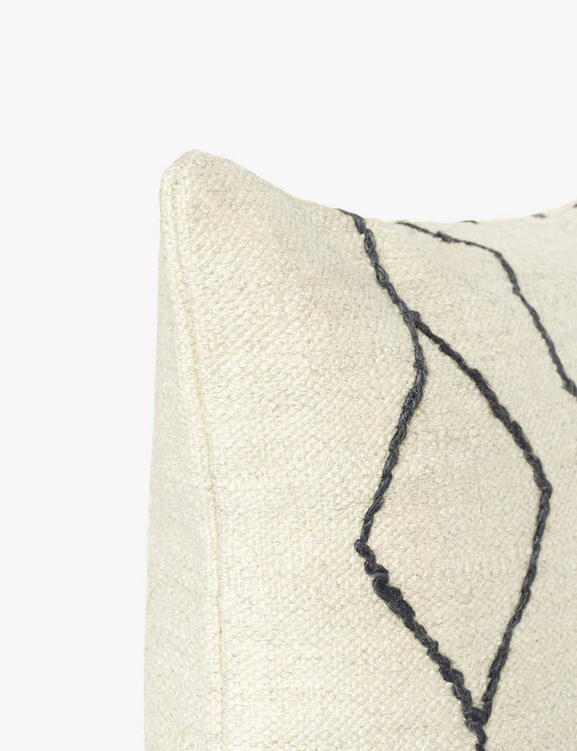 #color::black-&-natural #style::square | Close-up of the corner of the Moroccan black and natural beni ourain inspired square flat weave pillow by Sarah Sherman Samuel