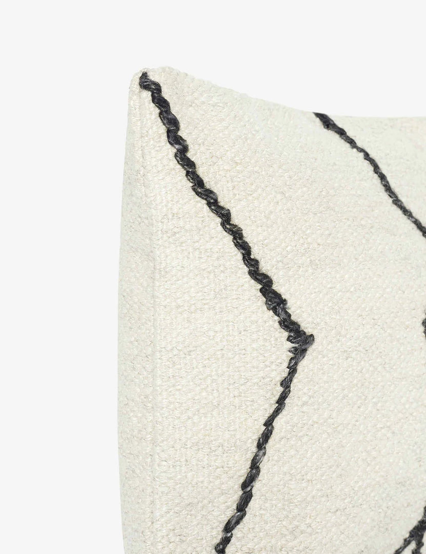#color::black-&-natural #style::lumbar | Close-up of the corner of the Moroccan black and natural beni ourain inspired lumbar flat weave pillow by Sarah Sherman Samuel