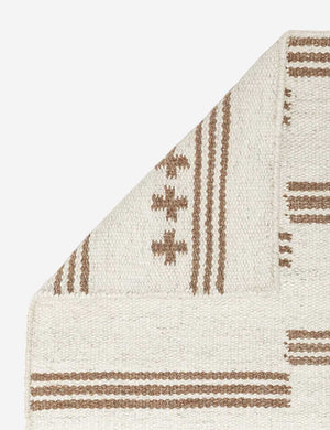 Close-up of the folder corner on the Stripe break flatweave rug by Sarah Sherman Samuel