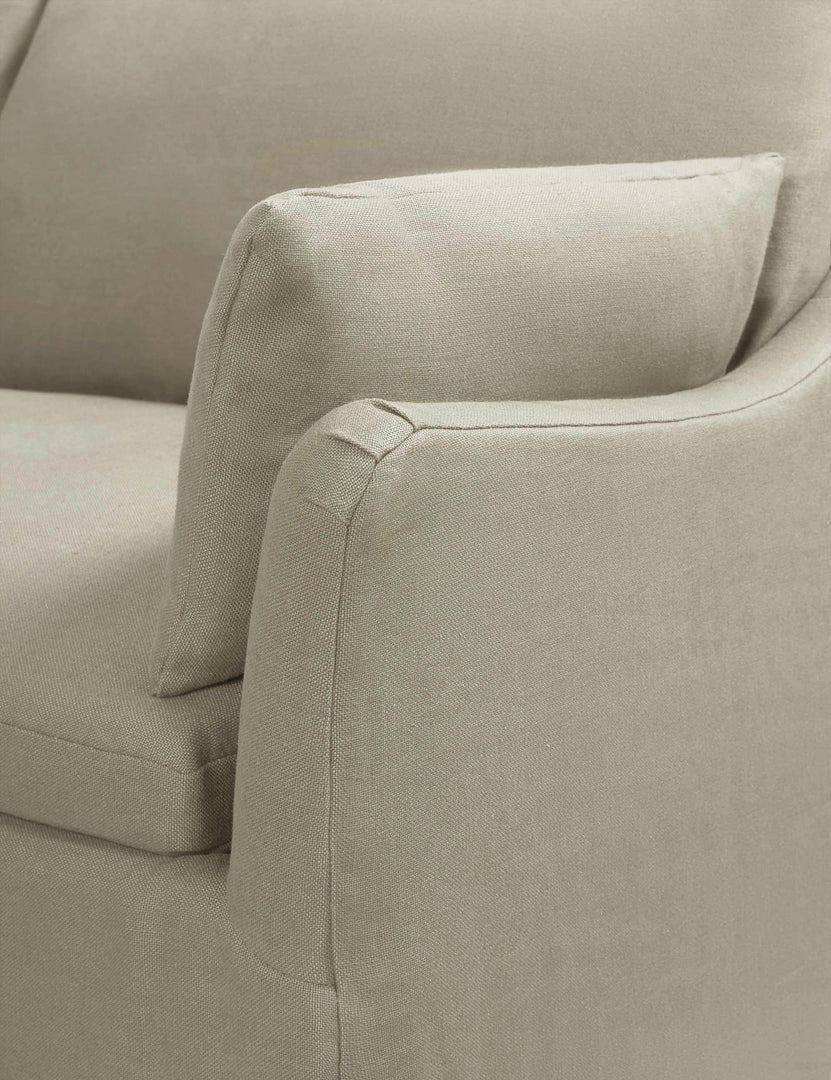#color::flax | Close-up of the sloped-arm on the Portola Flax linen Slipcover corner sectional Sofa