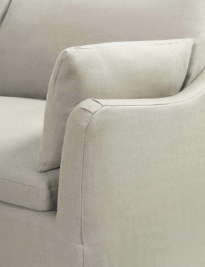 Close-up of the sloped-arm on the Portola Natural linen Slipcover corner sectional Sofa