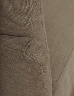 Close-up of the end of the sloped-arm on the Portola Mushroom brown linen Slipcover Sofa