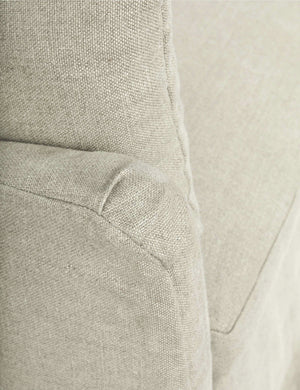 Close-up of the end of the sloped-arm on the Portola Natural linen Slipcover Sofa