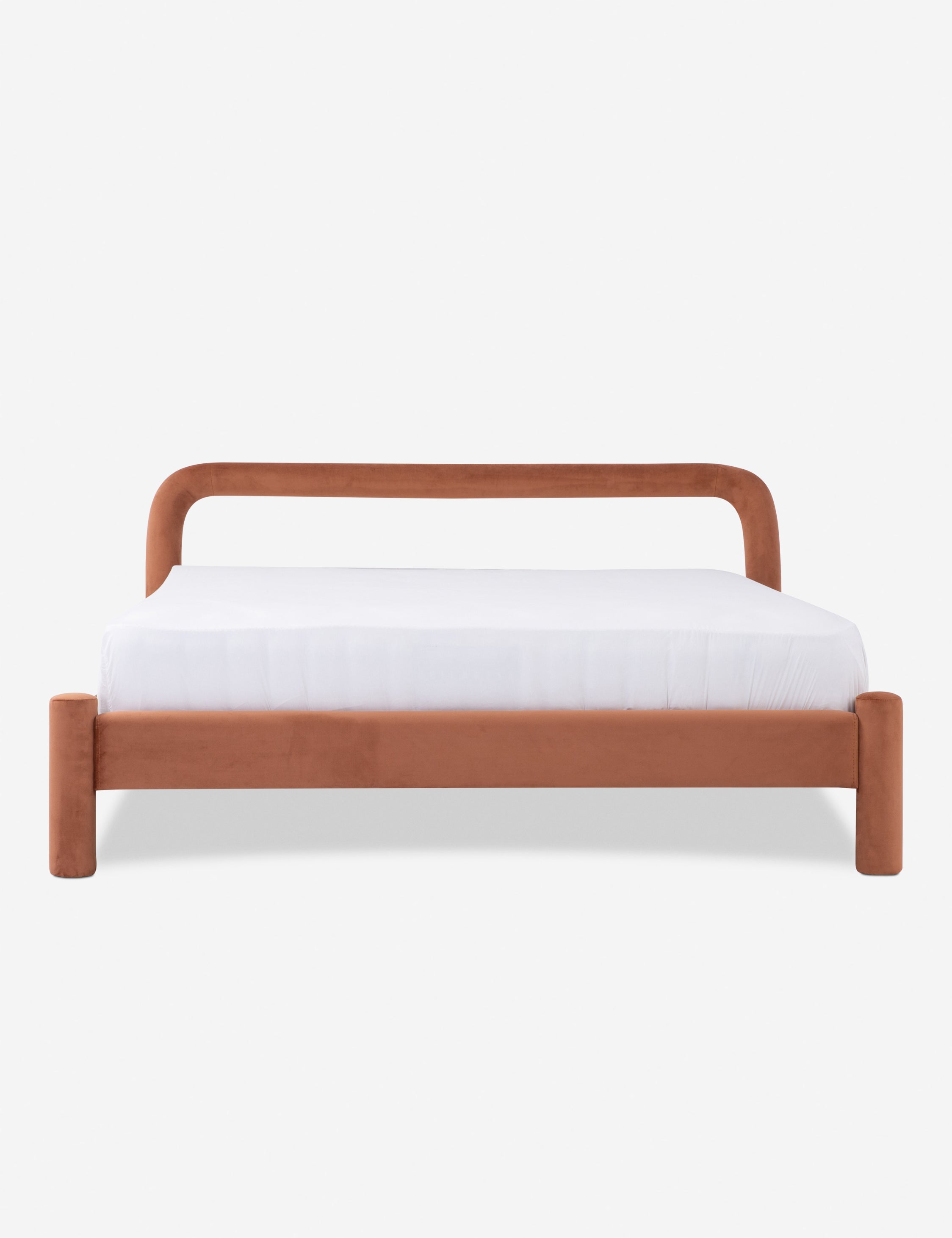 Close-up of the rounded headboard/side rail in terracotta fabric showing curved corner and seam details.