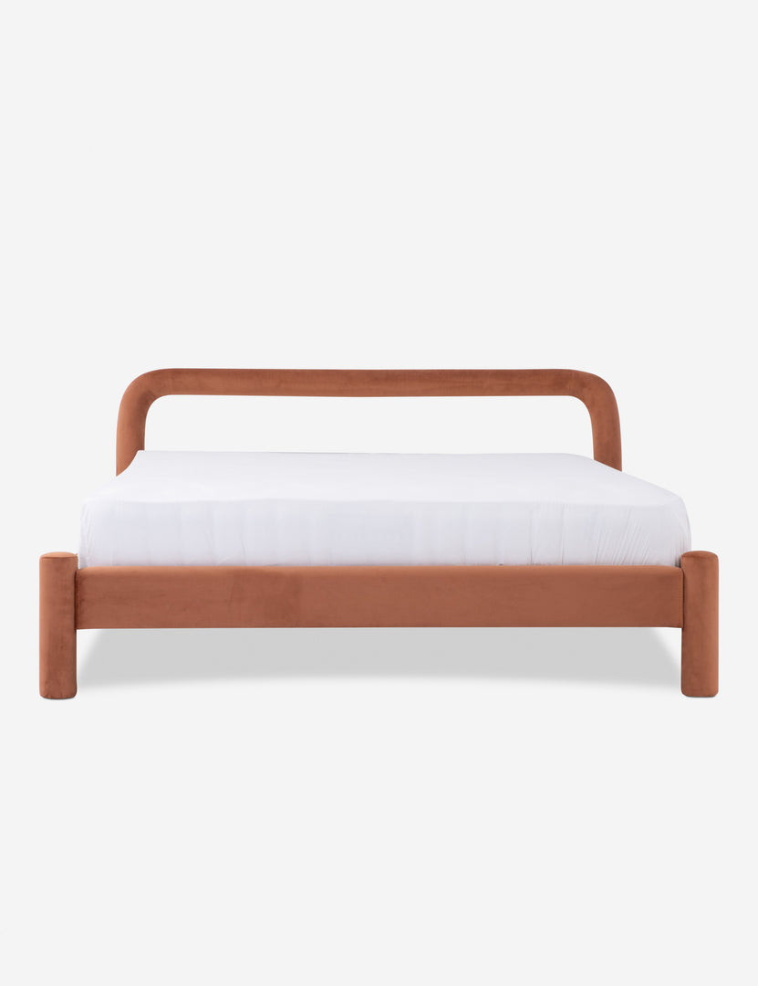 Close-up of the black upholstered headboard and bed rail with visible stitching details.