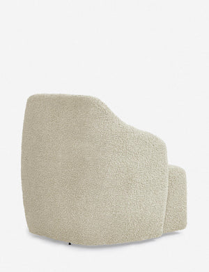 Angled rear view of the Tobi cream boucle swivel chair