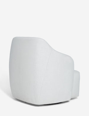 Angled rear view of the Tobi Natural linen swivel chair