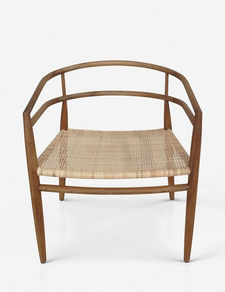 | Desie solid teak wood accent chair with a woven rattan seat, tapered legs, and a low curved back