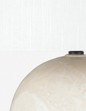 Close-up the shade and upper-half of the base of the Vivienne tan ceramic table lamp with spherical base
