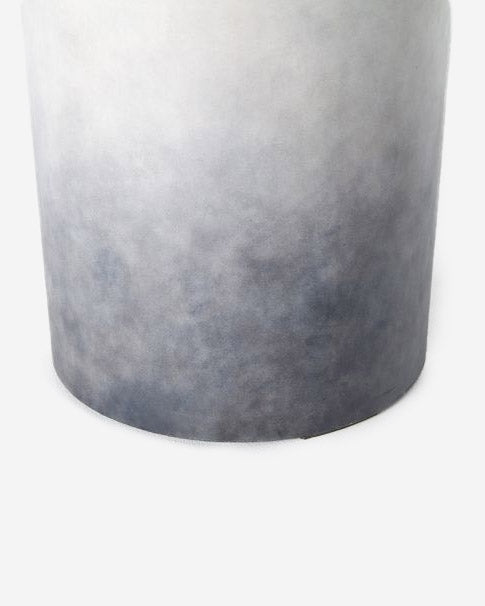 | Close-up of the bottom half of the Pira gray and white ombre indoor and outdoor side table