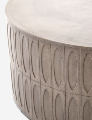 Close-up of the accented side on the Mal concrete indoor and outdoor round coffee table