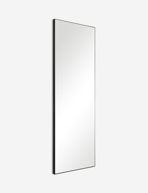 Angled view of the Shea rectangular black framed full length floor mirror