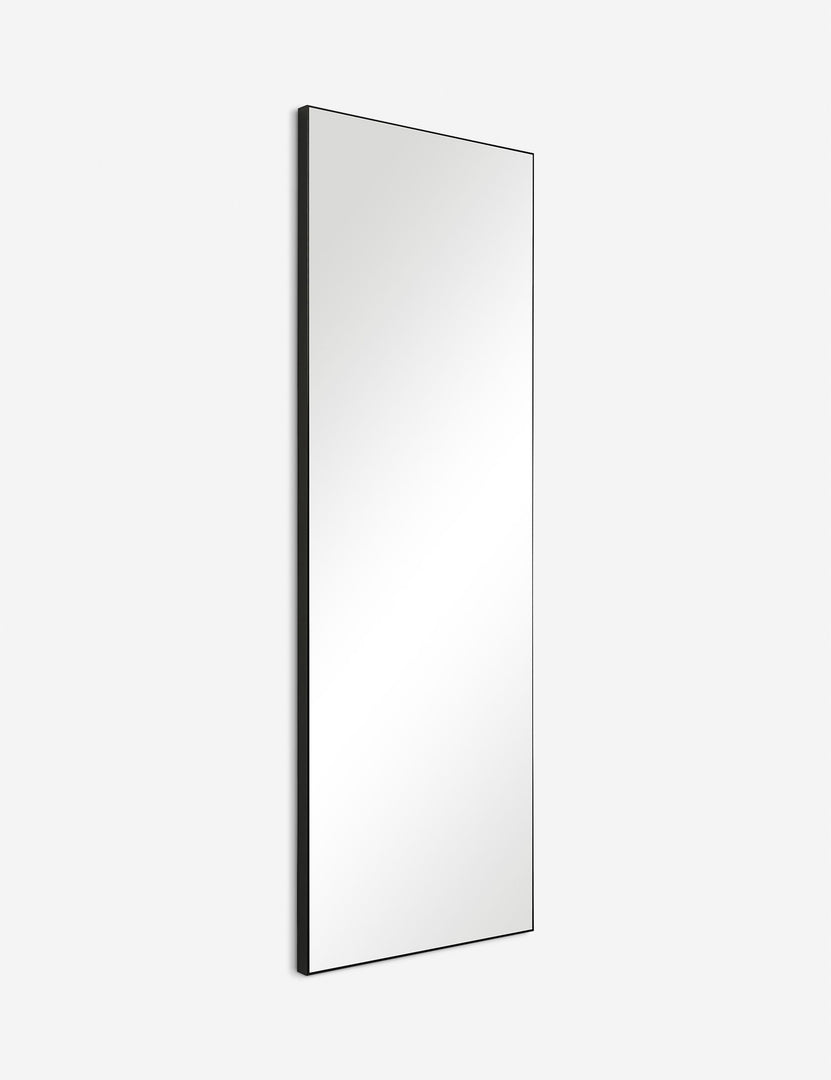 #color::black | Angled view of the Shea rectangular black framed full length floor mirror