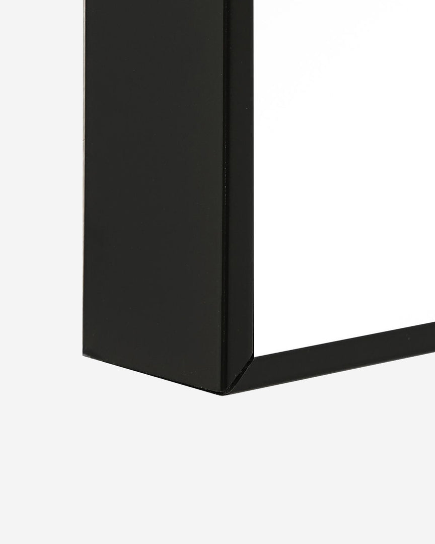 #color::black | Close-up of the black frame on the Shea rectangular full length floor mirror