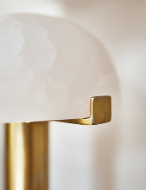 Close-up of the golden accent on the half-moon shade of the Lelani table lamp