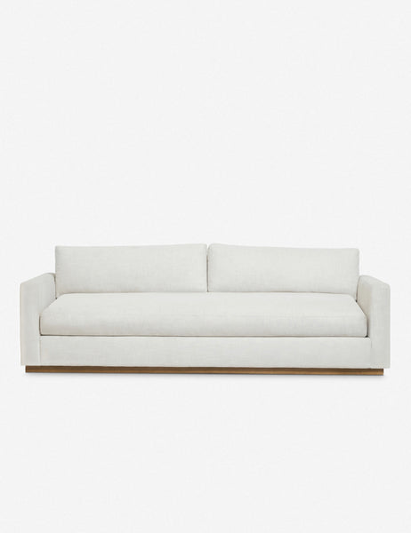 | Walden white upholstered sofa with a wood plinth base and deep seats