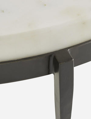 Close-up of the side of the white marble top where it connects with the base